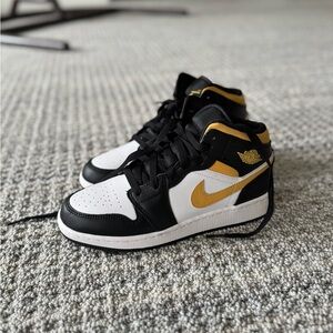 Nike Black and Gold Sneakers High-Top Design